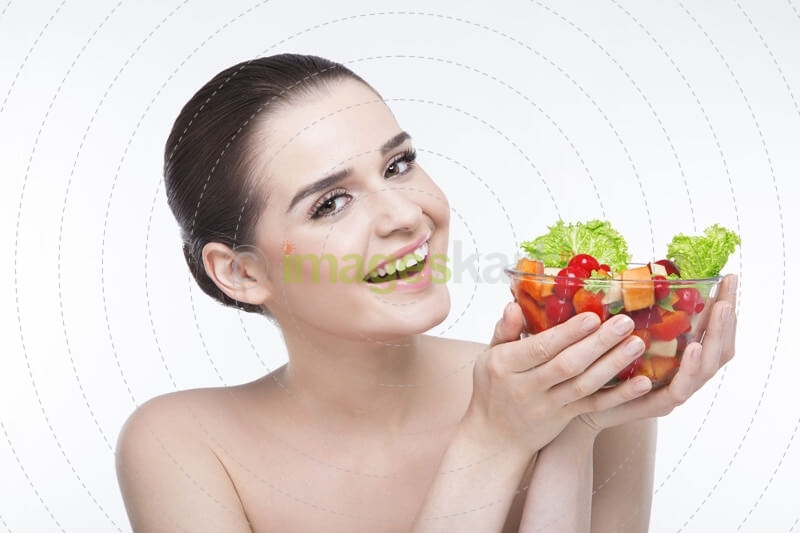 girl posing with salad bowl 