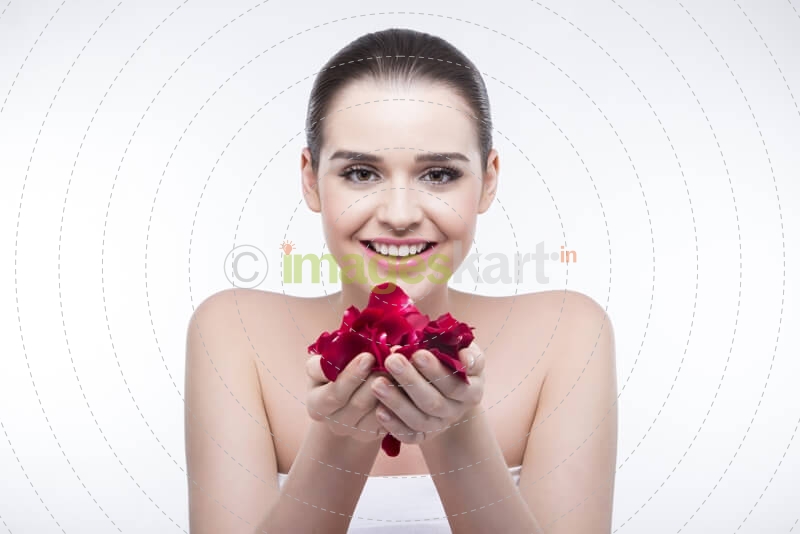 beautiful girl with rose petals 