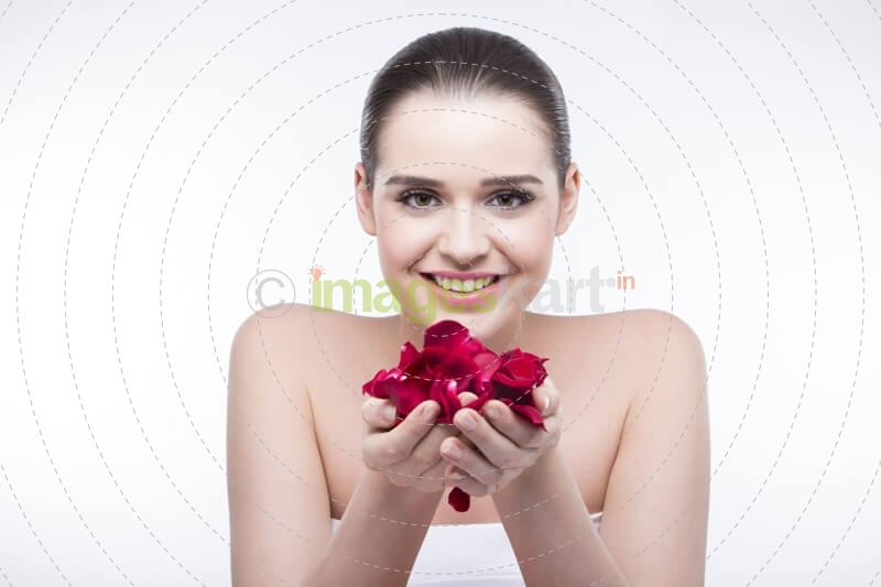 beautiful girl with rose petals 
