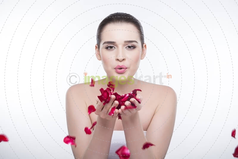beautiful girl with rose petals 