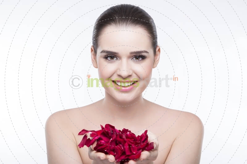 beautiful girl with rose petals 