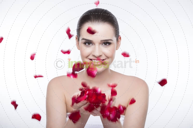 beautiful girl with rose petals 