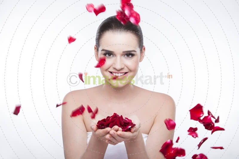 beautiful girl with rose petals 