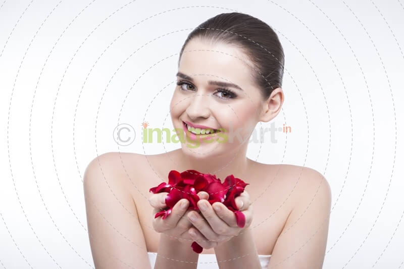 beautiful girl with rose petals 