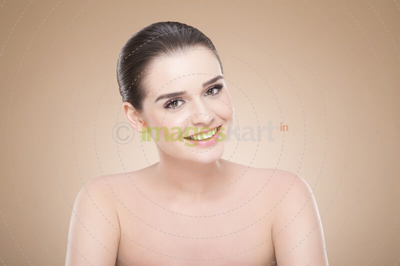girl with smooth skin posing while looking at the camera