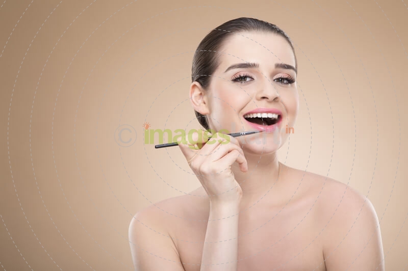 girl applying make up with brush