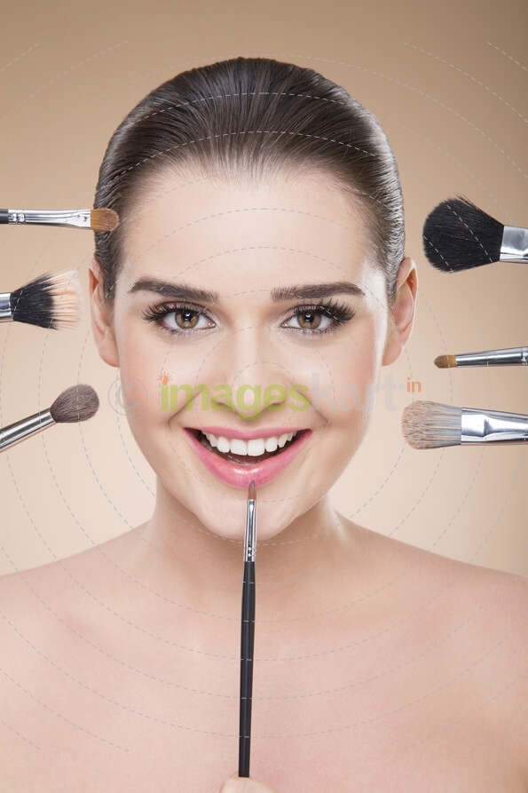 girl smiling during make up process
