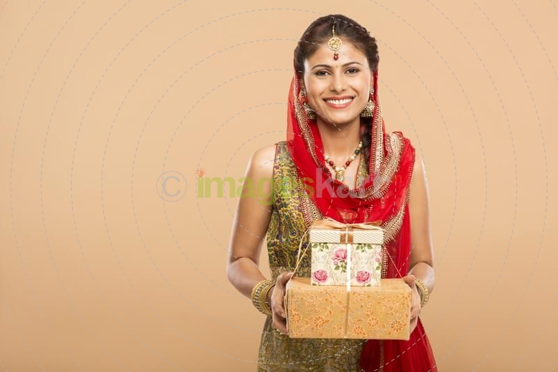 woman posing with gifts