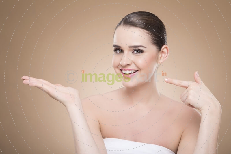 girl posing while pointing at hand
