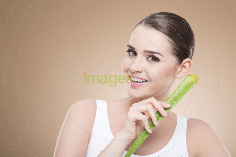 girl smiling and posing with aloe vera 