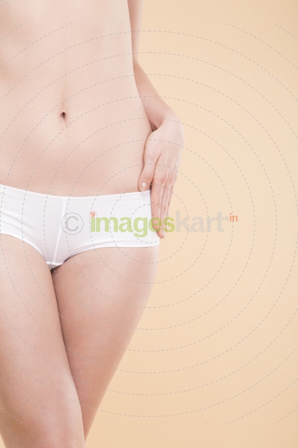 girl with flat belly showing her perfect skin