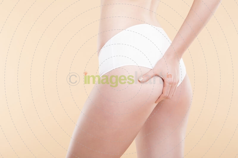 girl checking cellulite on her butt