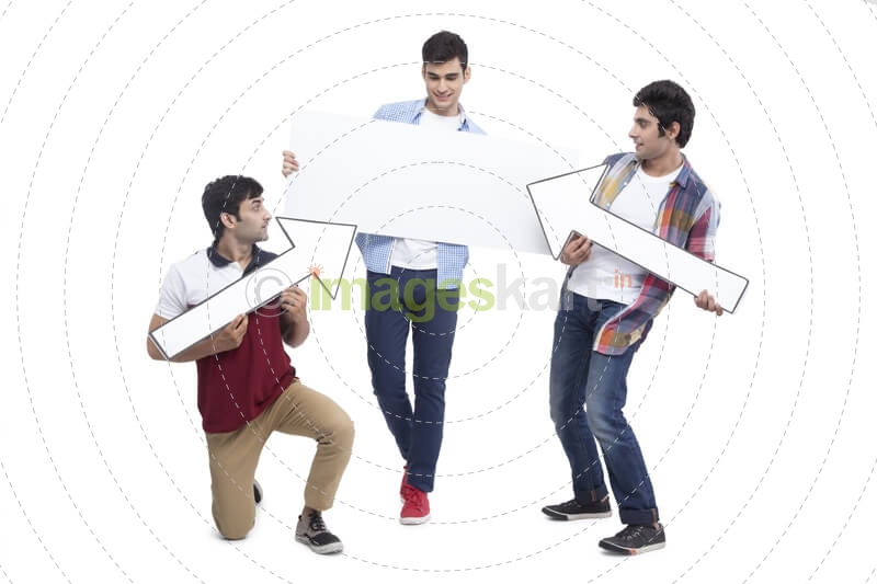 three friends posing with placard