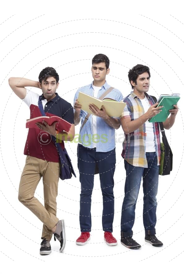 three college friends posing with assignments