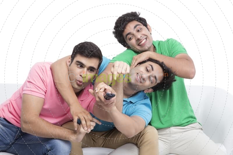 friends fighting for television remote