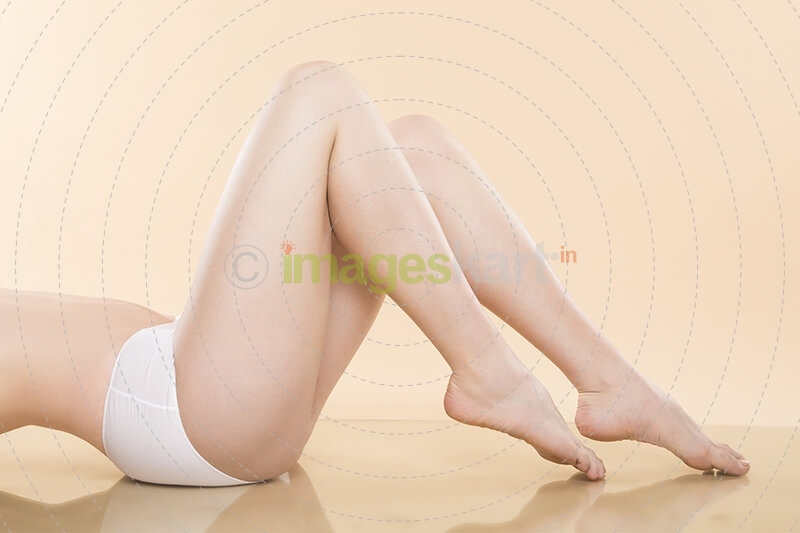 picture of a woman lying over and showing her legs