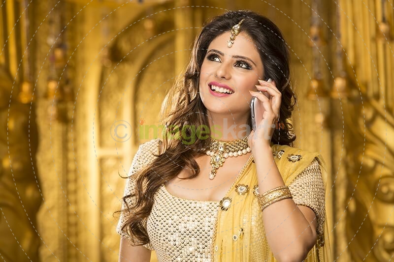 woman in traditional wear talking on phone