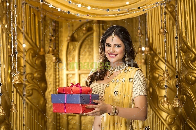 woman in traditional wear with gifts 
