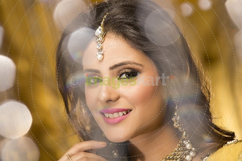 woman in traditional wear smiling and posing 