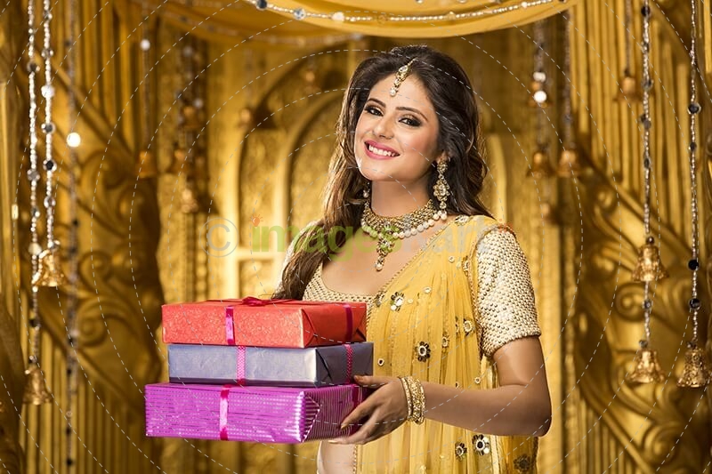 woman in traditional wear with gifts 