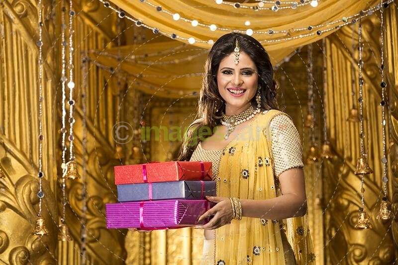 woman in traditional wear with gifts 
