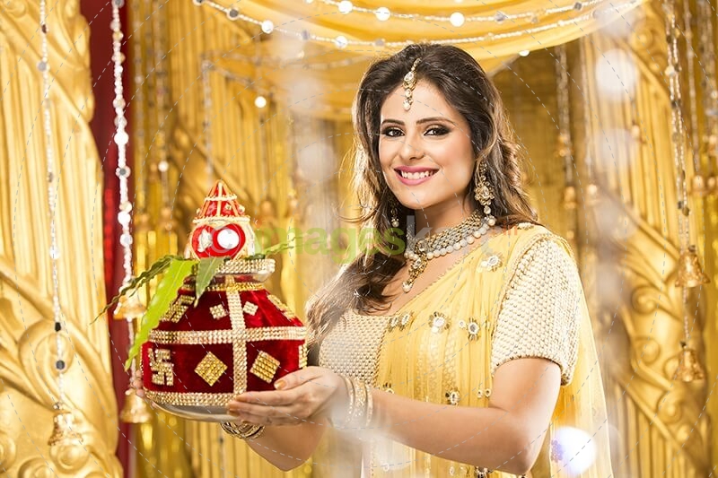 woman in traditional wear with kalash 