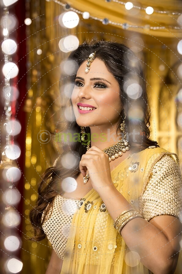 woman in traditional wear smiling and posing 