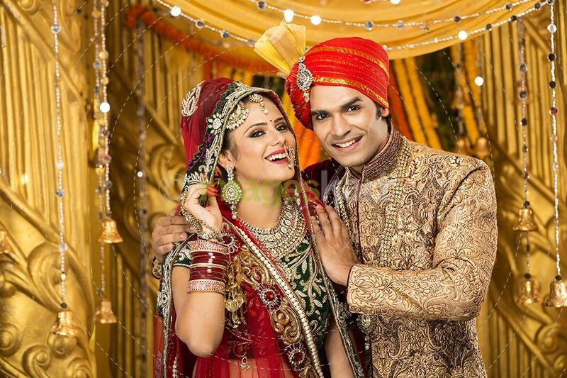indian bride and groom posing 