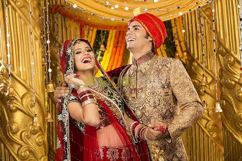 indian bride and groom posing 