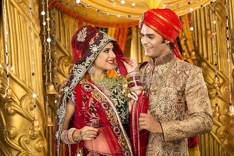 indian bride and groom posing 