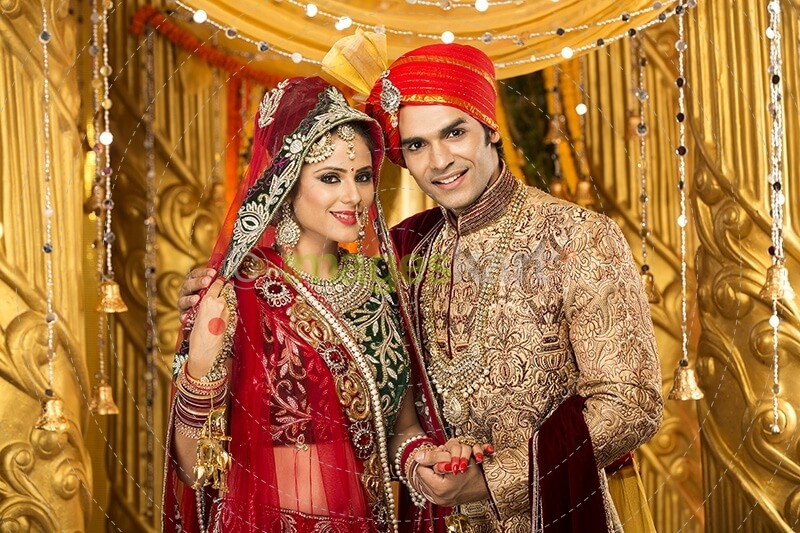indian bride and groom posing 