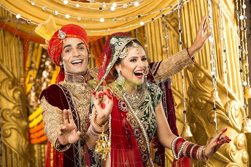 indian bride and groom dancing