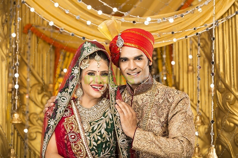 indian bride and groom posing 