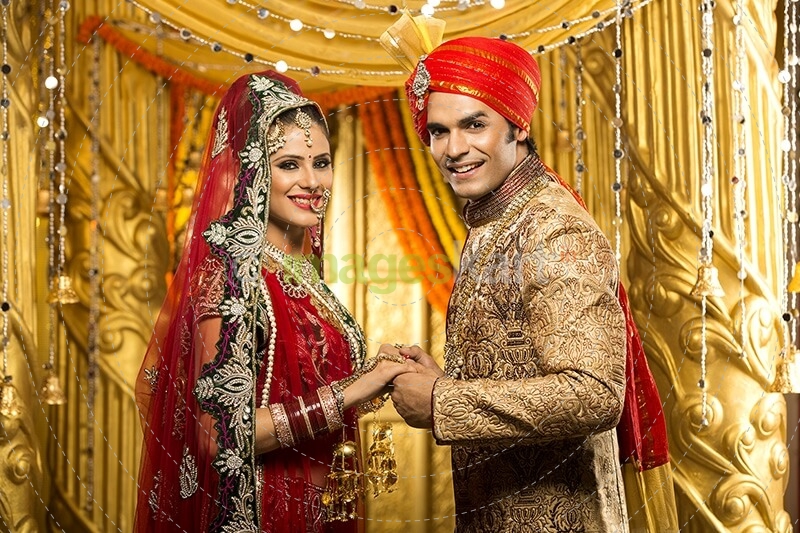 indian bride and groom posing 