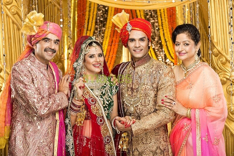 bride and groom with parents