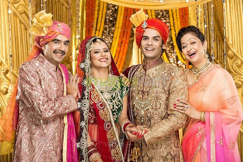 bride and groom with parents