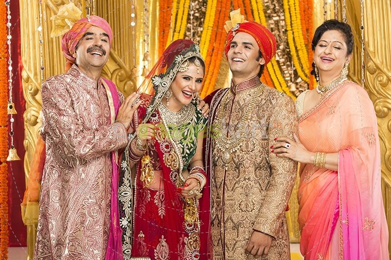 bride and groom with parents