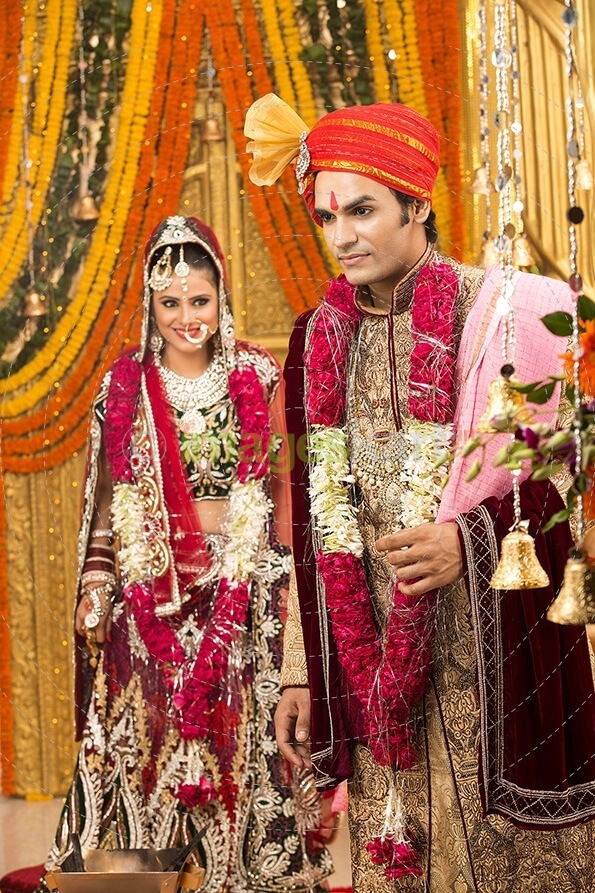 indian bride and groom taking pheras