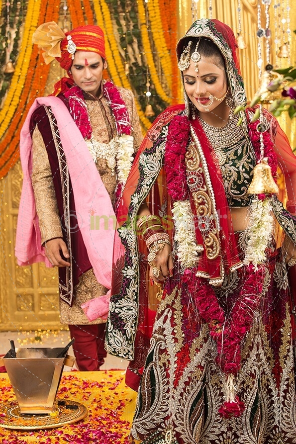 indian bride and groom taking pheras