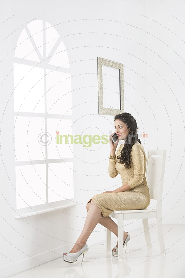 stylish young woman talking on mobile phone