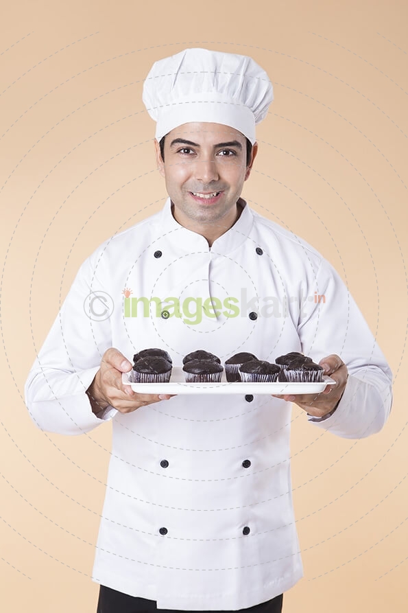 chef with cupcakes