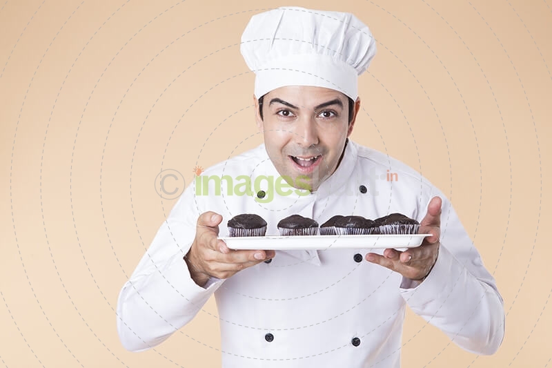 chef with cupcakes