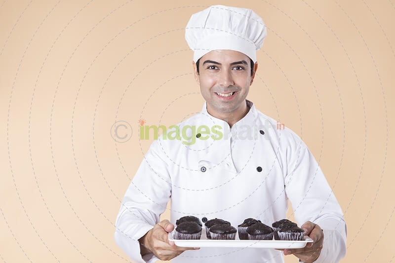 chef with cupcakes