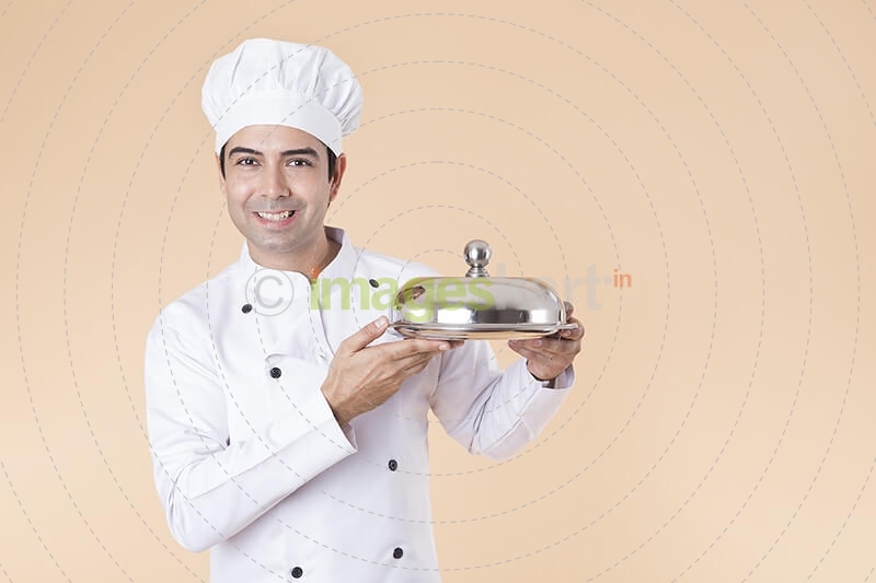 chef with serving tray