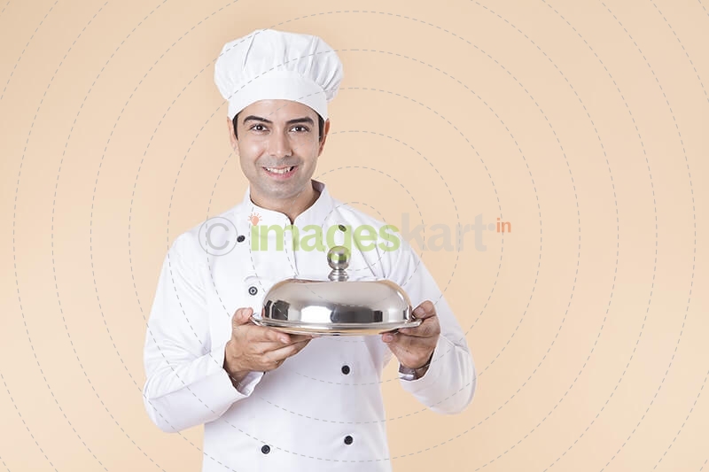chef with serving tray