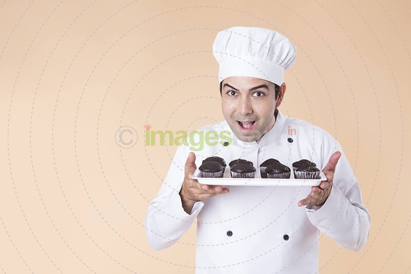 chef with cupcakes