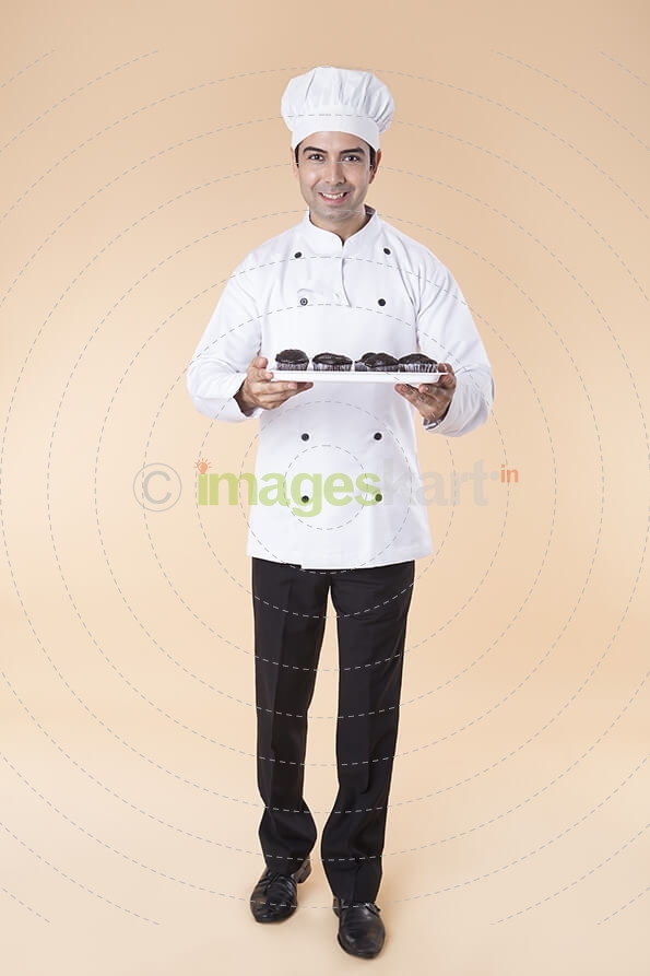 chef with cupcakes
