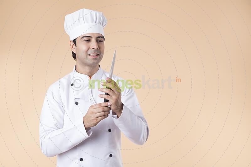 chef with knife in hand