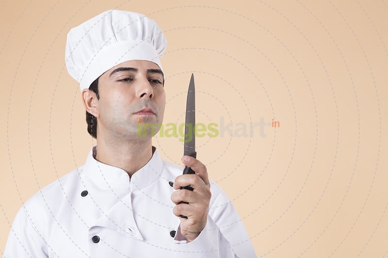 chef with knife in hand