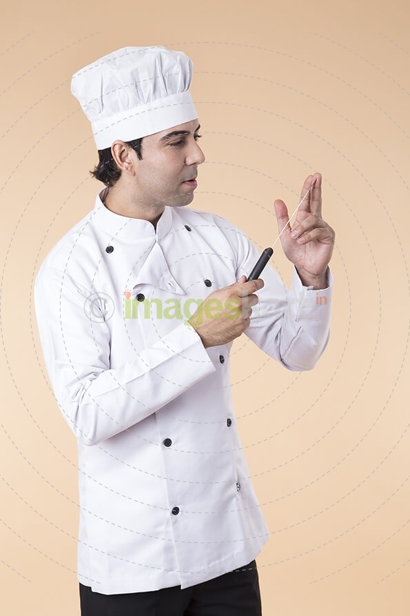 chef with knife in hand